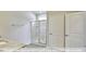 Bathroom with granite countertop, walk-in shower, and double doors at 1677 Abberly Pl, Graham, NC 27253