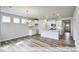 Open concept dining room with hardwood floors and chandelier at 1677 Abberly Pl, Graham, NC 27253