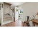 Inviting entryway with staircase, wood floors and view to backyard at 557 Olives Chapel Rd, Apex, NC 27502