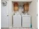 Laundry room with washer, dryer, and overhead storage at 557 Olives Chapel Rd, Apex, NC 27502