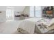 Spacious bedroom with a quilt bed and home office at 557 Olives Chapel Rd, Apex, NC 27502