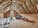 Unfinished attic with ample storage space and window at 557 Olives Chapel Rd, Apex, NC 27502