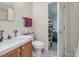 Small bathroom with toilet, sink, and access to storage at 557 Olives Chapel Rd, Apex, NC 27502