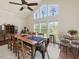 Bright dining room featuring a large table, hardwood floors, and scenic views at 557 Olives Chapel Rd, Apex, NC 27502