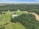 Wide aerial view of property and surrounding area at 557 Olives Chapel Rd, Apex, NC 27502