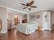 Spacious main bedroom with hardwood floors and ensuite bathroom access at 557 Olives Chapel Rd, Apex, NC 27502