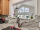 Kitchen features a pass-through window to the living area at 557 Olives Chapel Rd, Apex, NC 27502