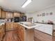 Spacious kitchen with island, ample storage, and granite countertops at 557 Olives Chapel Rd, Apex, NC 27502
