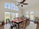 Bright dining room with farmhouse table and access to the backyard at 557 Olives Chapel Rd, Apex, NC 27502