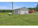 Metal detached garage with double doors and extra storage at 557 Olives Chapel Rd, Apex, NC 27502