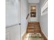 Wooden back stairs leading to the kitchen area at 557 Olives Chapel Rd, Apex, NC 27502