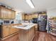 Modern kitchen with granite countertops and stainless steel appliances at 557 Olives Chapel Rd, Apex, NC 27502