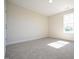 Bright and spacious bedroom with neutral carpeting and large window at 123 Johnson Ridge Way, Four Oaks, NC 27524