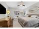 Main bedroom with king bed, sitting area, and TV at 1905 Wagoner St, Durham, NC 27705