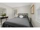 Bright bedroom with a comfortable bed and plenty of natural light at 1905 Wagoner St, Durham, NC 27705