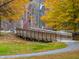 Wooden footbridge over a walking path, providing scenic access at 1905 Wagoner St, Durham, NC 27705