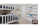 bedroom with bunk beds, built-in shelving, and globe at 1905 Wagoner St, Durham, NC 27705