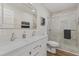 Elegant bathroom with double vanity, marble countertops, and walk-in shower at 1905 Wagoner St, Durham, NC 27705