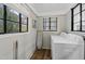 Laundry room with washer, dryer, and cabinets at 1905 Wagoner St, Durham, NC 27705