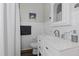 Clean bathroom with white vanity, quartz countertop, and shower/tub combo at 1905 Wagoner St, Durham, NC 27705