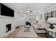 Cozy living room featuring a fireplace, comfortable seating, and large TV at 1905 Wagoner St, Durham, NC 27705
