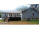 Gray house exterior with a deck and stairs at 513 N Carr St, Mebane, NC 27302