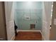 Laundry room with built-in shelving and hardwood floors at 513 N Carr St, Mebane, NC 27302