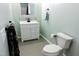 Bathroom with vanity, toilet, and tiled floor at 513 N Carr St, Mebane, NC 27302