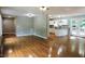 Open concept living and kitchen area with hardwood floors at 513 N Carr St, Mebane, NC 27302