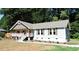 Charming one-story home with a covered porch and landscaped yard at 513 N Carr St, Mebane, NC 27302