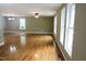 Spacious living room featuring hardwood floors and large windows at 513 N Carr St, Mebane, NC 27302