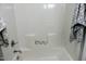 Clean bathroom with a bathtub and shower combination at 513 N Carr St, Mebane, NC 27302