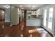Modern kitchen with white cabinets, granite countertops, and stainless steel appliances at 513 N Carr St, Mebane, NC 27302
