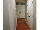 Bright hallway with hardwood floors and access to other rooms at 513 N Carr St, Mebane, NC 27302