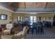 Spacious community room with tables, chairs, and a high ceiling at 75 Bur Oak Ct, Pittsboro, NC 27312