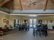 Spacious community room with tables, chairs, and a high ceiling at 75 Bur Oak Ct, Pittsboro, NC 27312