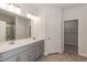 Elegant bathroom with double vanity, large mirror, and walk-in shower at 50 Lemon Drop Ln, Franklinton, NC 27525