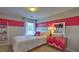 Charming bedroom featuring a full bed, accent wall, and plenty of natural light at 2824 Egert Dr, Haw River, NC 27258