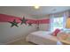 Spacious bedroom with a full-size bed and large window offering natural light at 2824 Egert Dr, Haw River, NC 27258