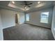 Large main bedroom with ceiling fan and ensuite bathroom access at 90 Watermelon Dr, Franklinton, NC 27525
