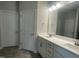Double vanity bathroom with white cabinets and quartz countertop at 90 Watermelon Dr, Franklinton, NC 27525