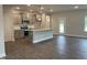 Open concept kitchen with island, granite countertops, and stainless steel appliances at 90 Watermelon Dr, Franklinton, NC 27525