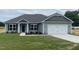 Charming one-story house with gray siding and a two-car garage at 90 Watermelon Dr, Franklinton, NC 27525