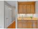 Convenient wet bar with granite countertop and wood cabinetry at 3201 Environ Way # Bldg 3000, Chapel Hill, NC 27517