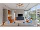 Living room with hardwood floors, a ceiling fan, and a view of the bedroom at 3201 Environ Way # Bldg 3000, Chapel Hill, NC 27517