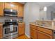 Stainless steel appliances and light wood cabinets in this efficient kitchen at 3201 Environ Way # Bldg 3000, Chapel Hill, NC 27517