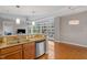 Hardwood floor dining area with city views and modern light fixture at 3201 Environ Way # Bldg 3000, Chapel Hill, NC 27517