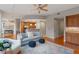 Open living area with hardwood floors, comfy seating, and built-in shelving at 3201 Environ Way # Bldg 3000, Chapel Hill, NC 27517