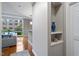 Bright hallway with built-in shelving and view into living room at 3201 Environ Way # Bldg 3000, Chapel Hill, NC 27517