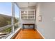 Sunlit home office boasts built-in shelving and hardwood floors at 3201 Environ Way # Bldg 3000, Chapel Hill, NC 27517